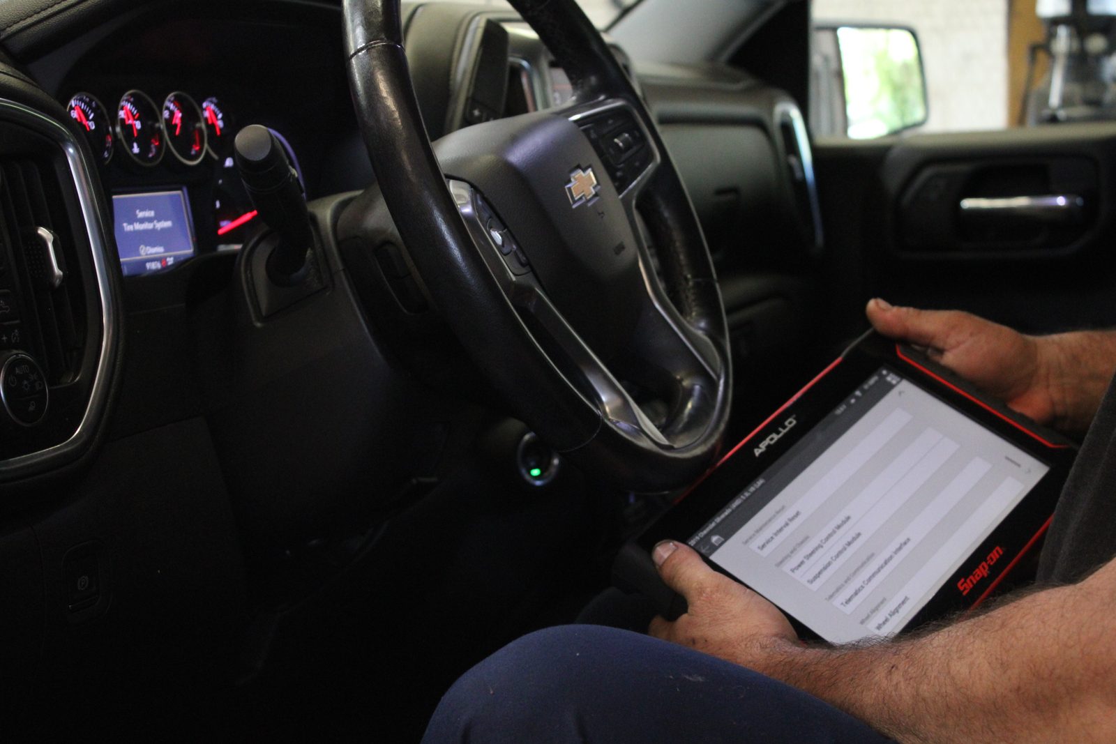 Technician running a diagnostic scan on a customer vehicle