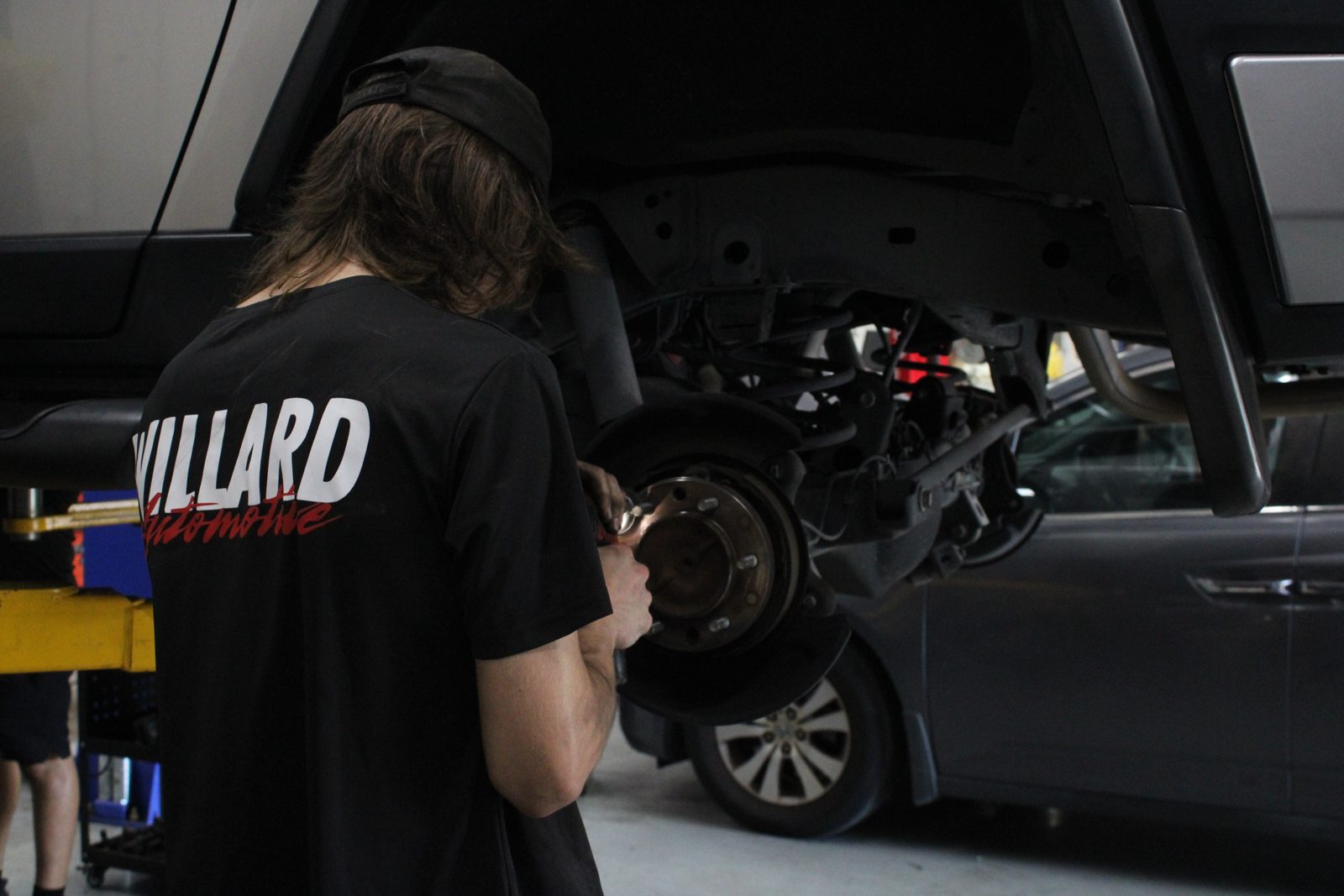 Garage Collective technician servicing a wheel hub assembly